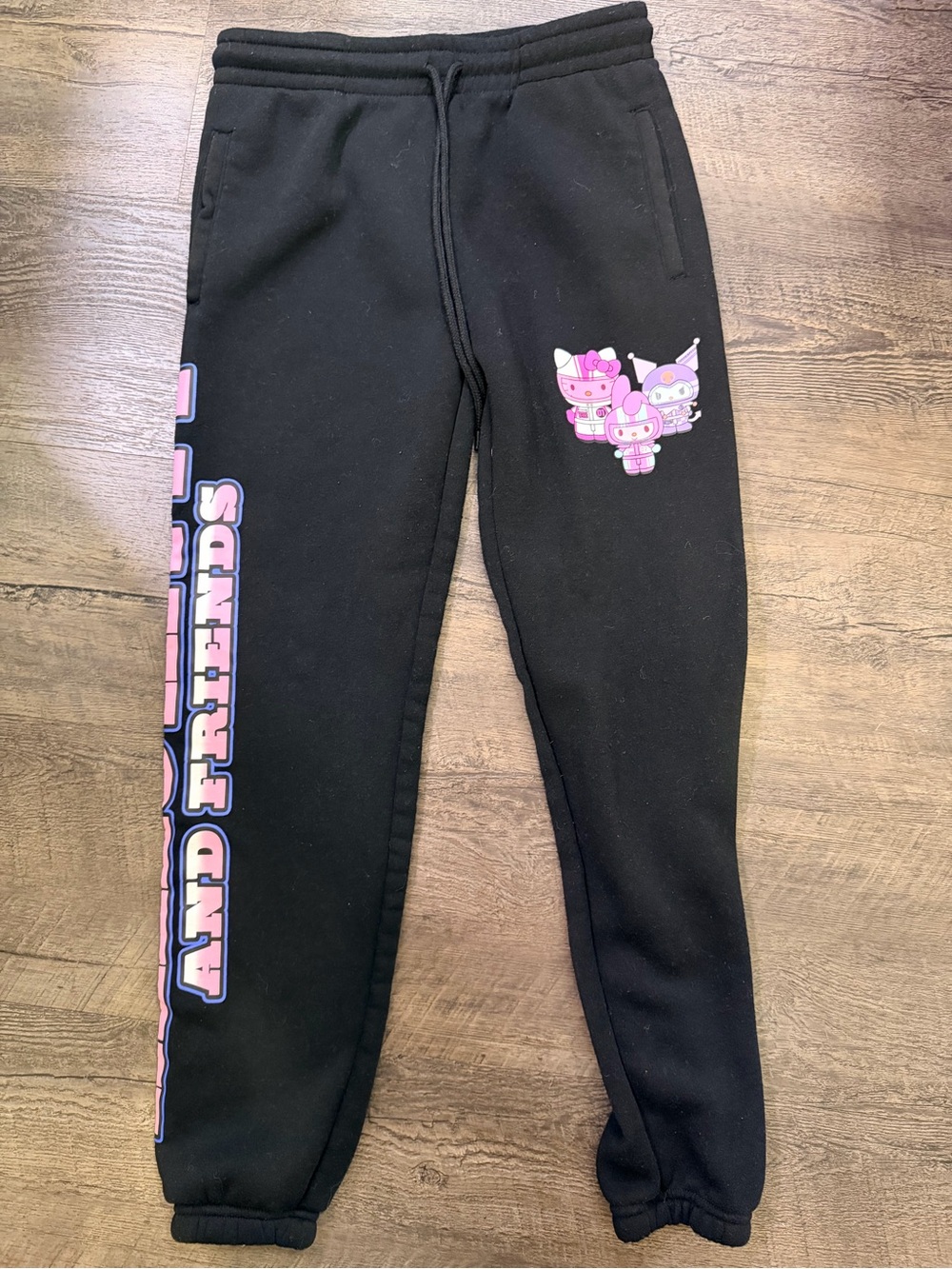 Sanrio Black Sweatpants with Pink Cartoon Character Graphics